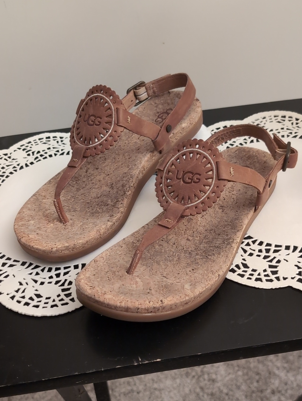 UGG Women's Tan Leather Thong Sandals with Decorative Medallion